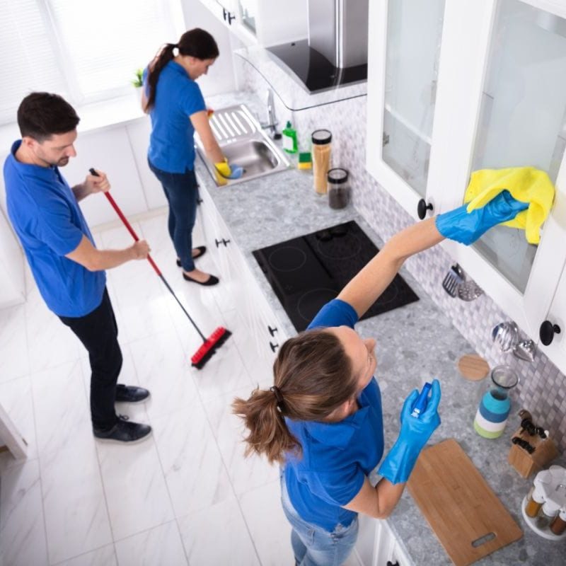 Exceptional weekly cleaning in Sellersburg, IN with a professional cleaning team dusting, mopping, and sanitizing a residential kitchen services near me