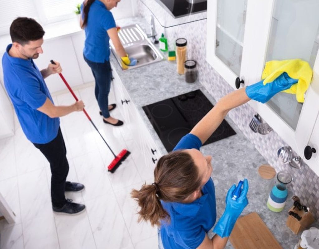 Exceptional weekly cleaning in Sellersburg, IN with a professional cleaning team dusting, mopping, and sanitizing a residential kitchen services near me